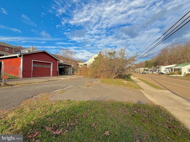 exterior space with a carport and a garage