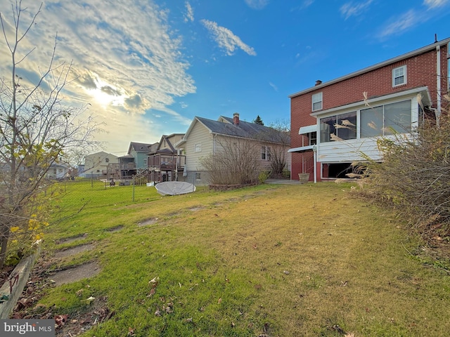 view of yard with a sunroom