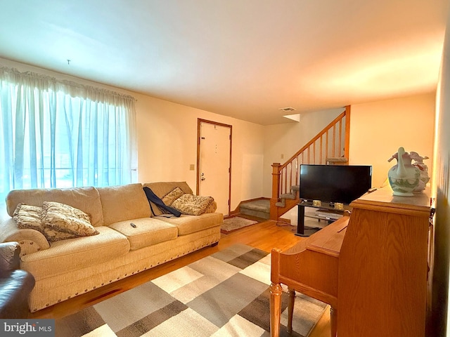 living room with light hardwood / wood-style flooring