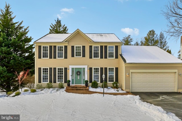 colonial inspired home with a garage