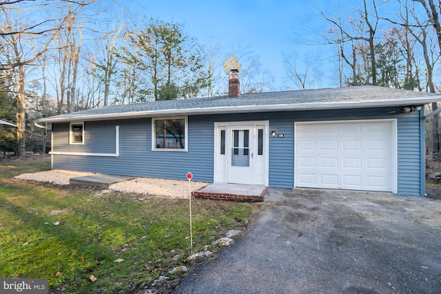 ranch-style home featuring a garage