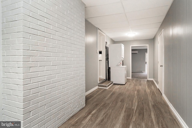 corridor featuring dark hardwood / wood-style flooring and a wall unit AC