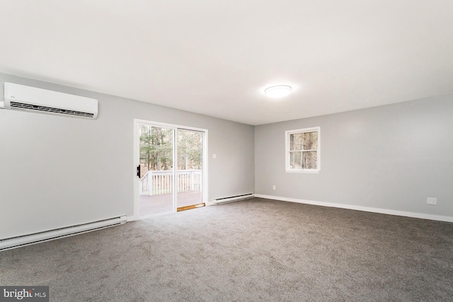 spare room with an AC wall unit, carpet floors, and a baseboard radiator