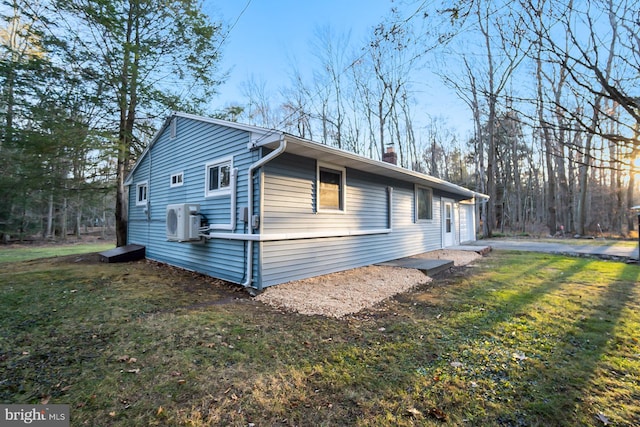 view of side of property featuring a yard