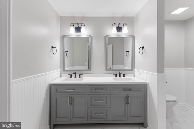 bathroom with vanity and toilet