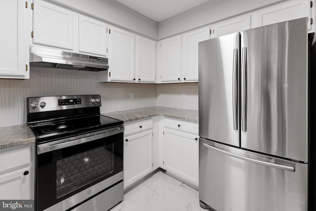 kitchen featuring appliances with stainless steel finishes, white cabinetry, and light stone counters