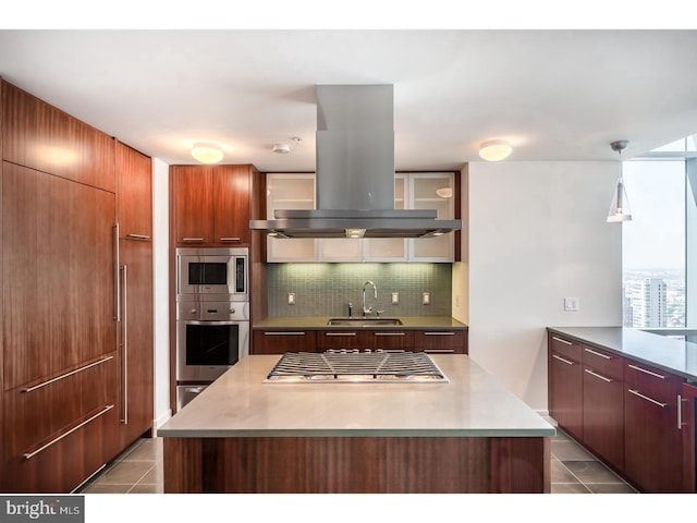 1414 S Penn Sq S Unit 45Gh, Philadelphia, PA 19102 - kitchen with appliances with stainless steel finishes, island exhaust hood, tile patterned flooring, decorative backsplash, and modern cabinets
