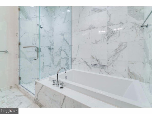 1414 S Penn Sq S Unit 45Gh, Philadelphia, PA 19102 - full bath with a marble finish shower and a garden tub