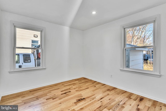 spare room with light hardwood / wood-style floors