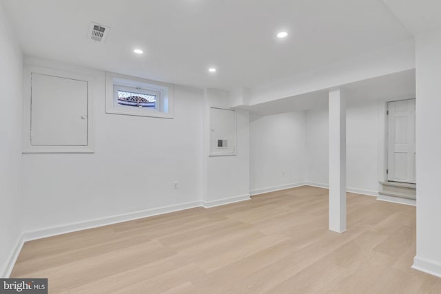 basement featuring light hardwood / wood-style floors