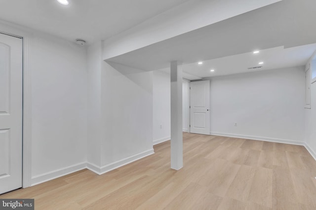 basement featuring light hardwood / wood-style flooring