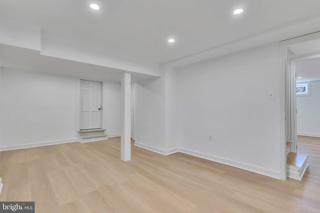 basement featuring light hardwood / wood-style flooring