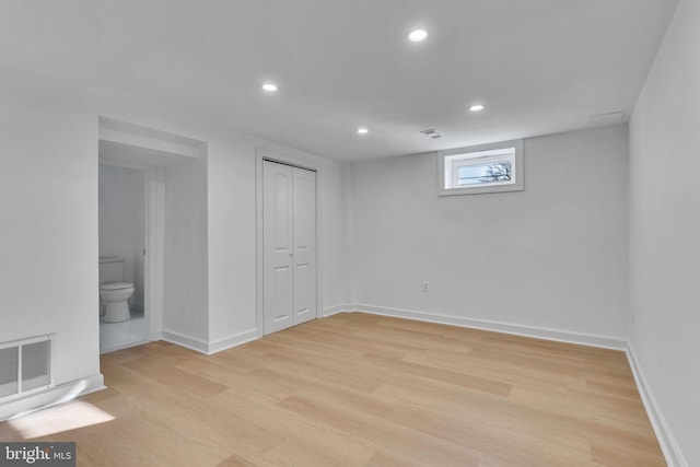 basement featuring light hardwood / wood-style flooring