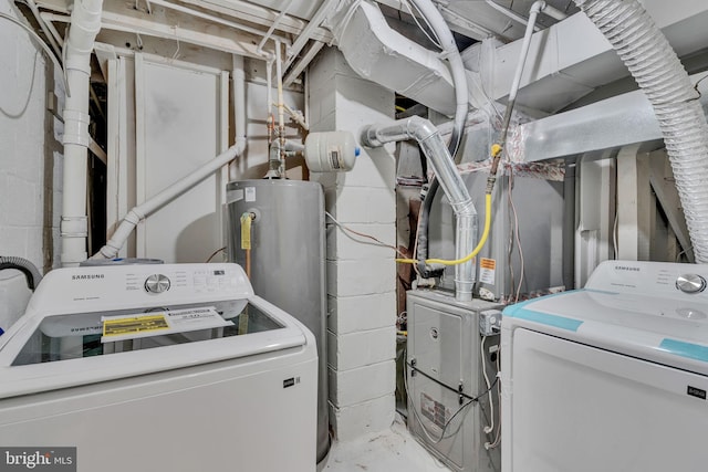 laundry area featuring washer and clothes dryer and water heater