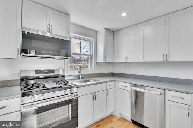 kitchen featuring white cabinets and appliances with stainless steel finishes