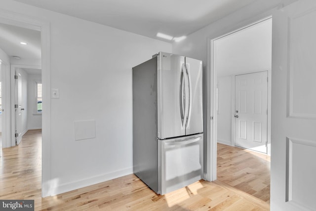 kitchen featuring stainless steel refrigerator and light wood-type flooring