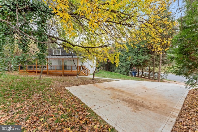 view of yard featuring a deck and a sunroom