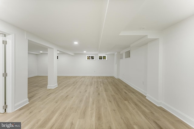 basement featuring light hardwood / wood-style floors