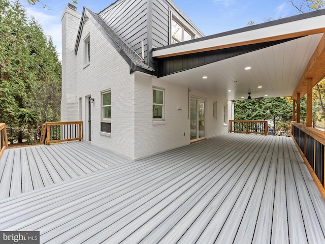 wooden terrace featuring ceiling fan