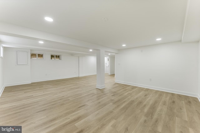 basement featuring light wood-type flooring