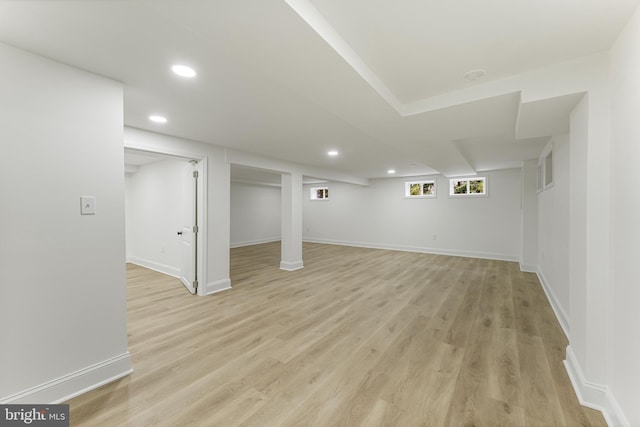 basement featuring light wood-type flooring