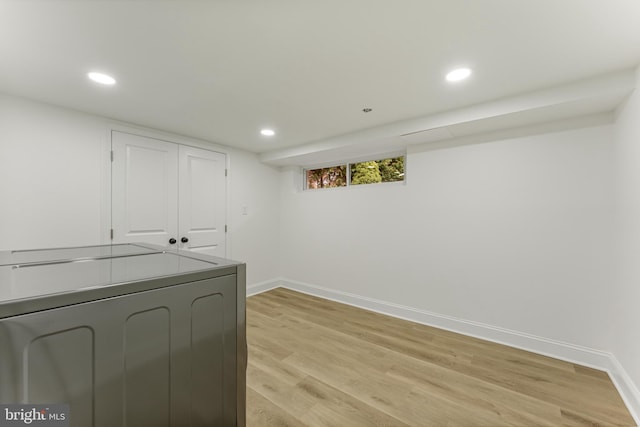 interior space with washer / clothes dryer and light hardwood / wood-style flooring