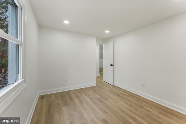 empty room featuring light hardwood / wood-style flooring and a healthy amount of sunlight