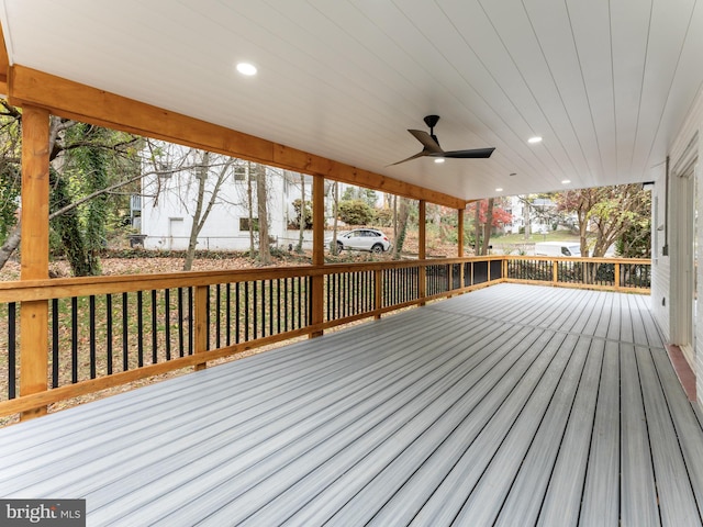 wooden deck featuring ceiling fan