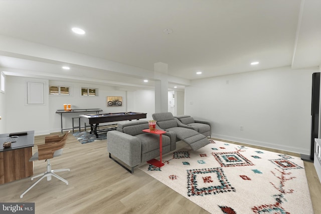 living room featuring light wood-type flooring and billiards