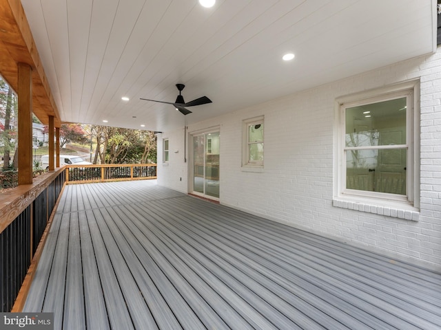 wooden terrace featuring ceiling fan