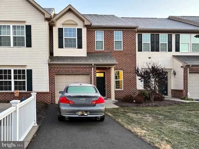 multi unit property featuring a garage