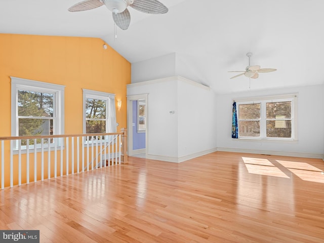 unfurnished living room with ceiling fan, light hardwood / wood-style flooring, and high vaulted ceiling