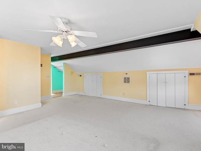 interior space with ceiling fan