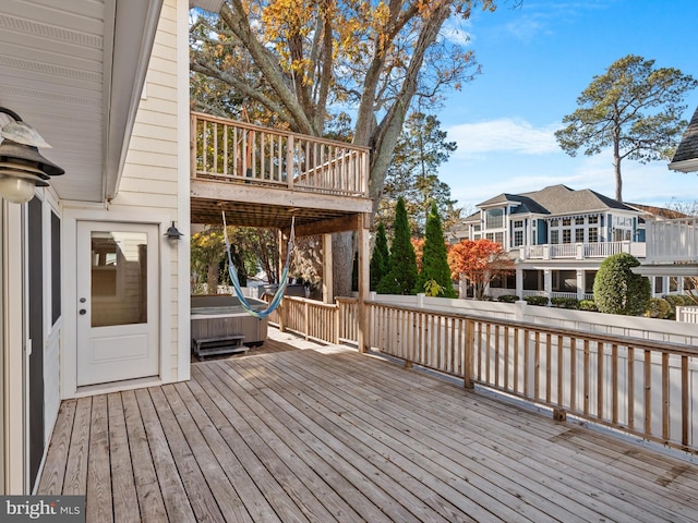 deck featuring a hot tub