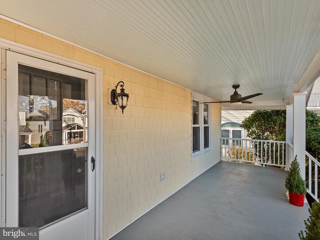 view of patio with ceiling fan and a porch