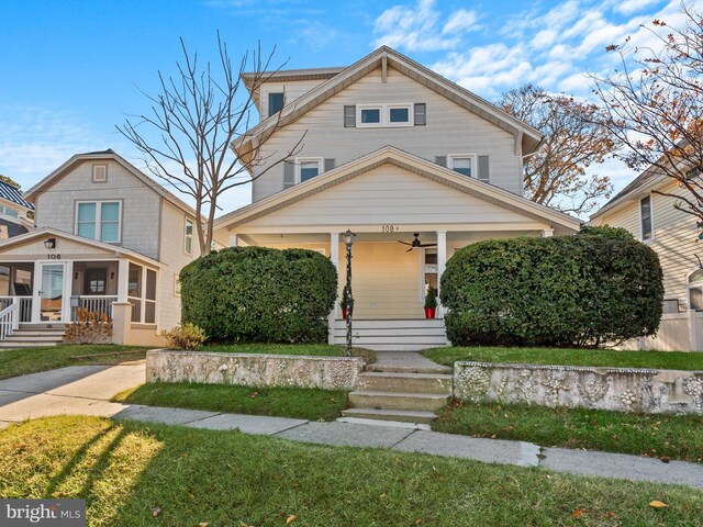 108 Philadelphia St Unit B, Rehoboth Beach, DE 19971 - american foursquare style home with covered porch, a ceiling fan, and a front yard
