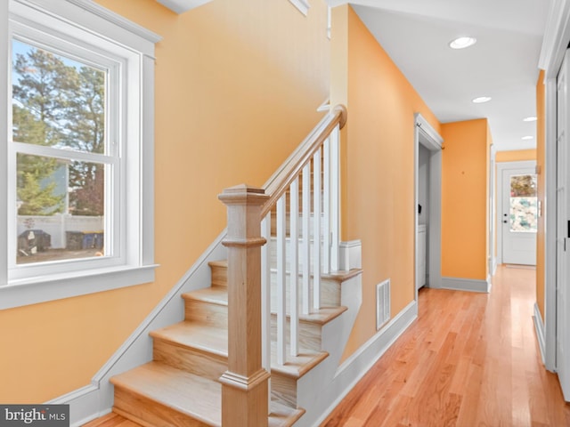 stairway featuring hardwood / wood-style flooring