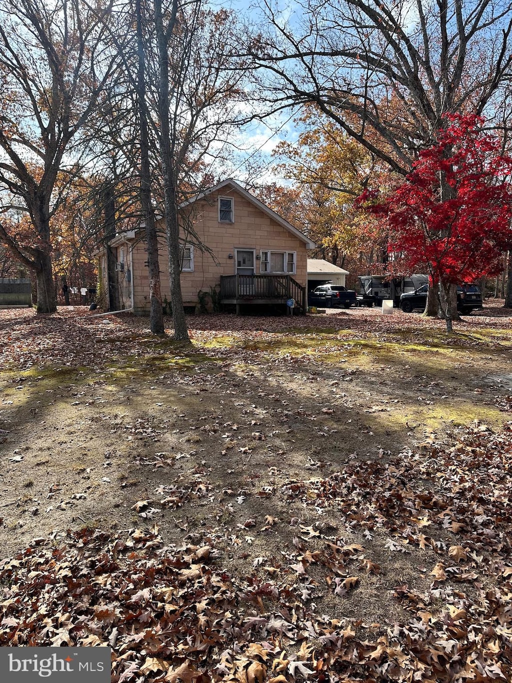 view of side of home with a deck