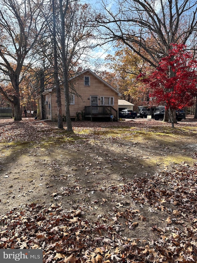 view of side of home with a deck