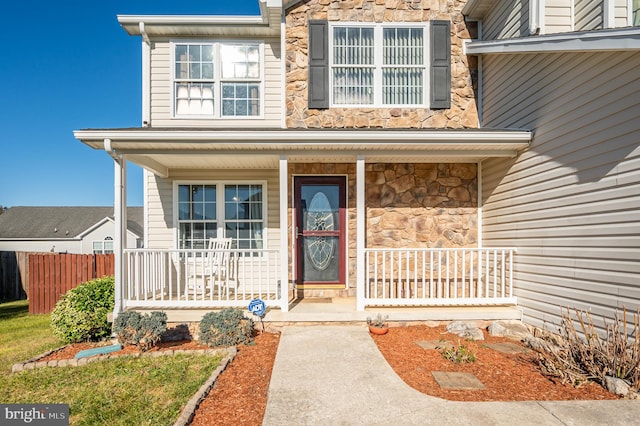 doorway to property with a porch