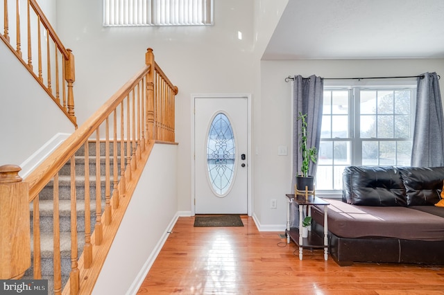 foyer entrance featuring hardwood / wood-style floors