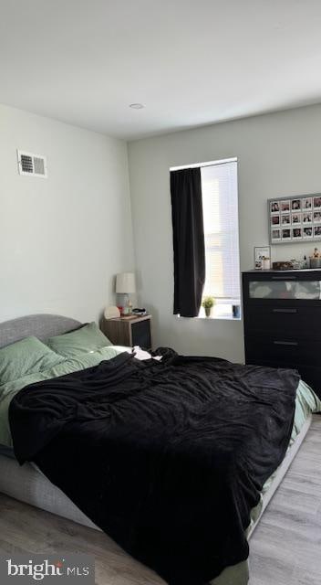 bedroom with light hardwood / wood-style flooring