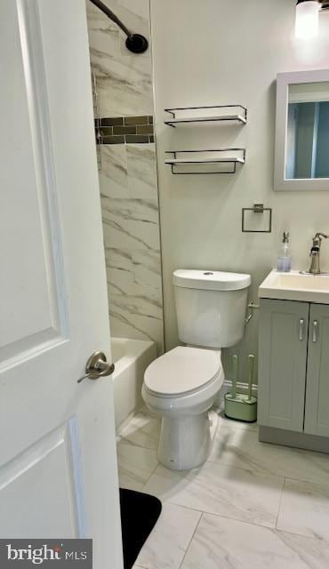 full bathroom featuring vanity, toilet, and tiled shower / bath