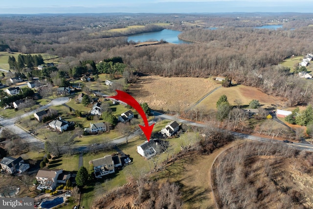 birds eye view of property featuring a water view