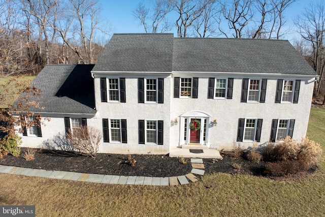 colonial house with a front lawn