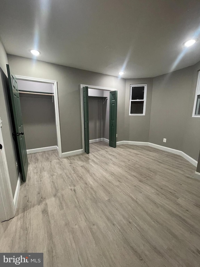 unfurnished bedroom with light hardwood / wood-style floors