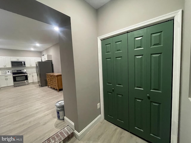 foyer entrance featuring light hardwood / wood-style floors