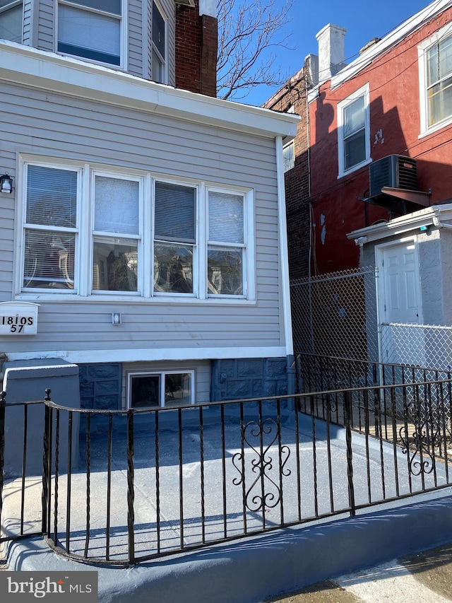 view of side of property with central AC unit