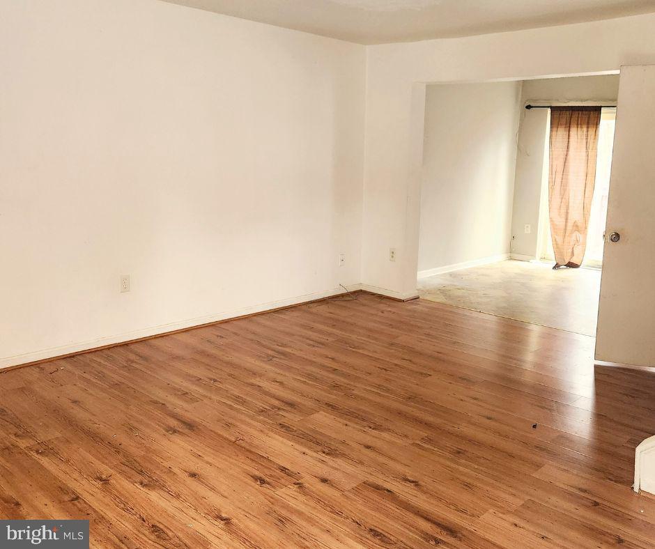 empty room with light hardwood / wood-style flooring