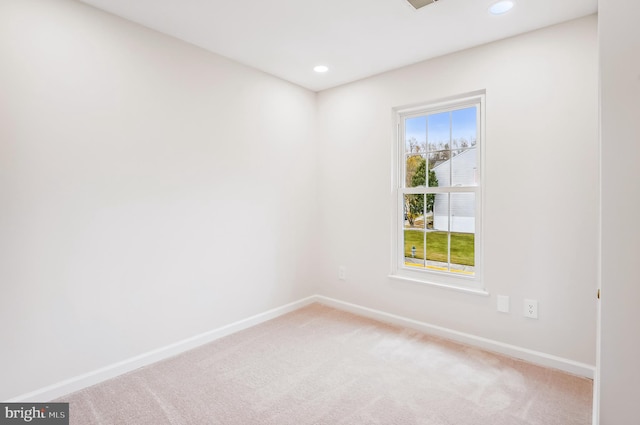 unfurnished room featuring carpet floors